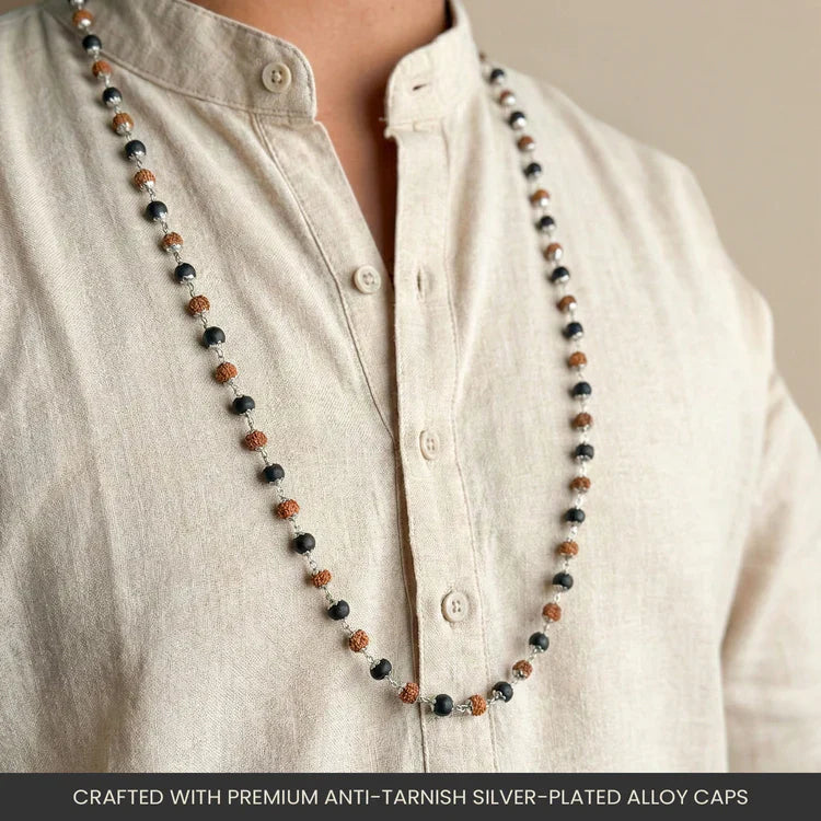 Rudraksha and Karungali mala with silver-plated alloy capping worn around the neck over a cream kurta